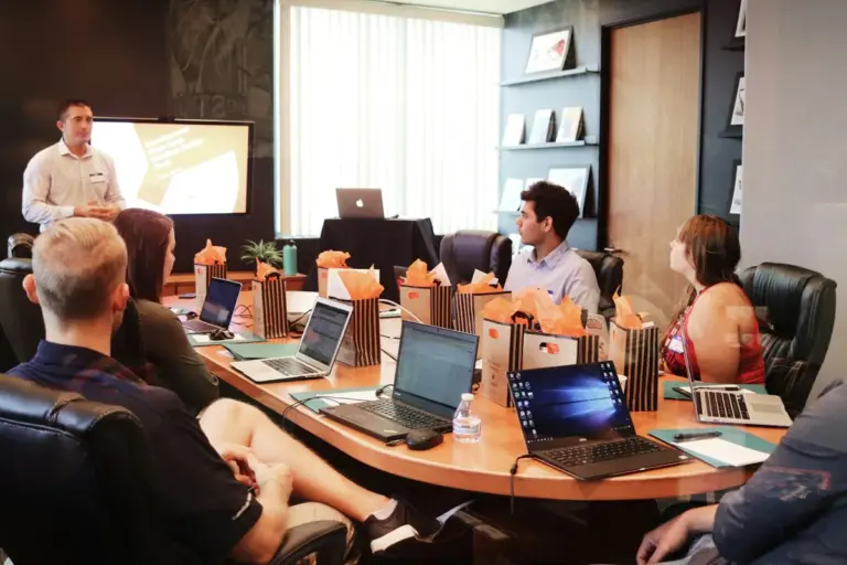 Participants attending a workshop around a conference table