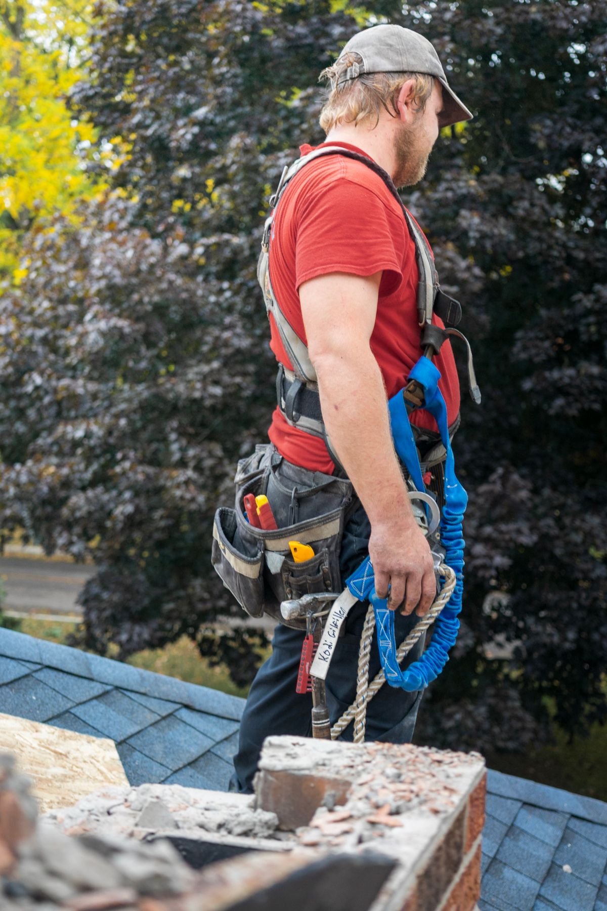 Professional roofer preparing a roof inspection