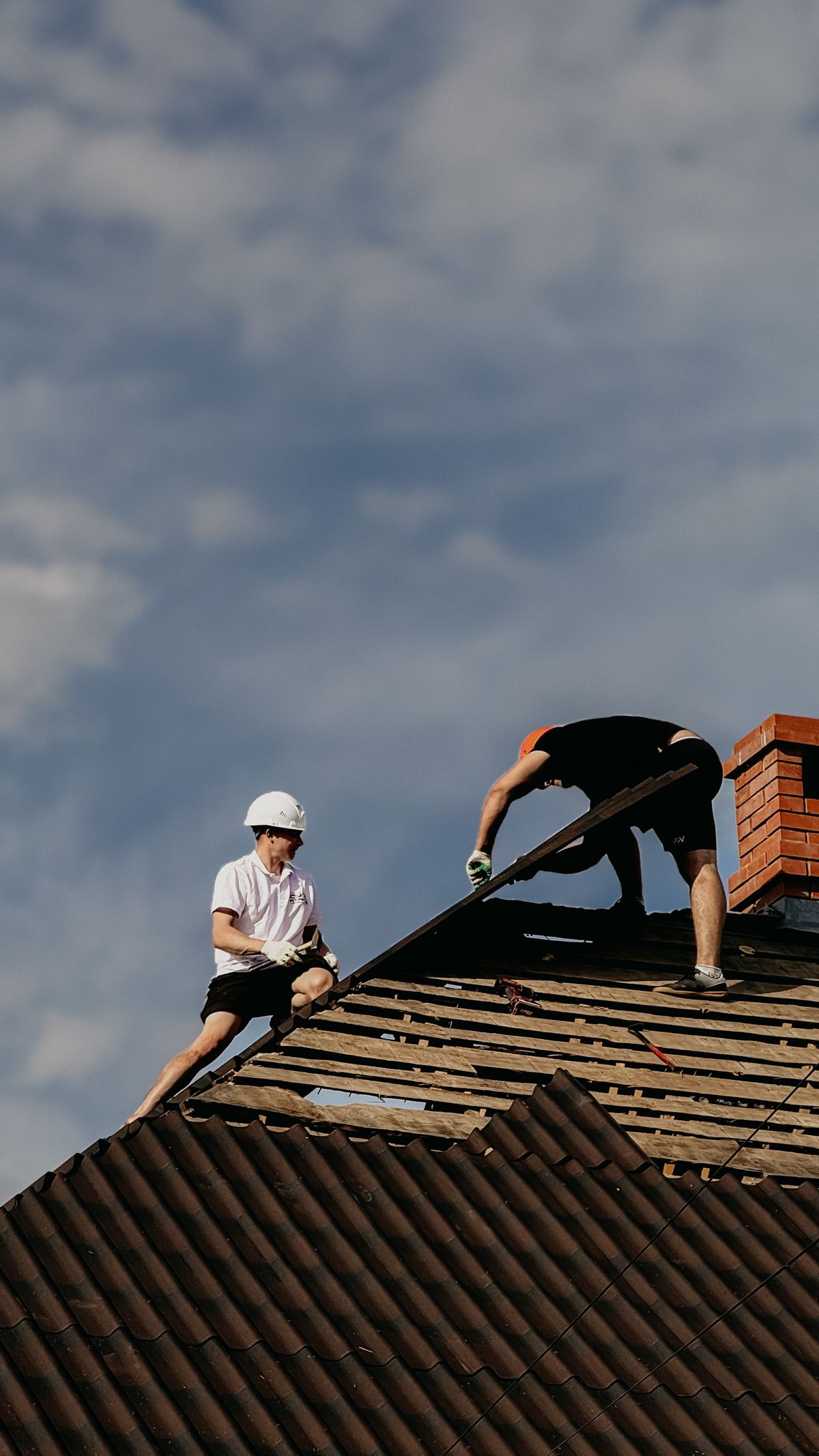 Roofing crew completing a roof repair