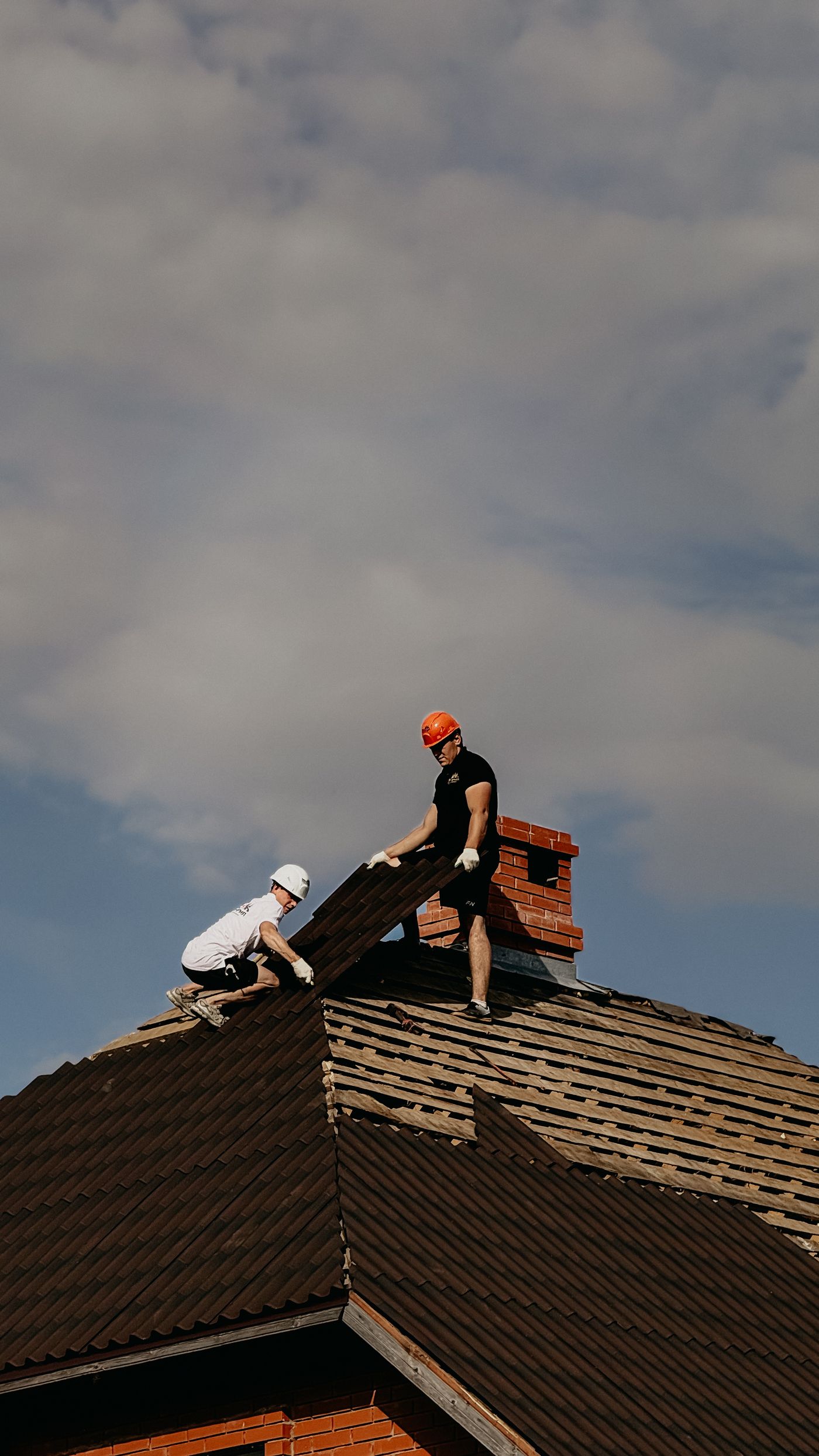 Roofers working on a residential roof